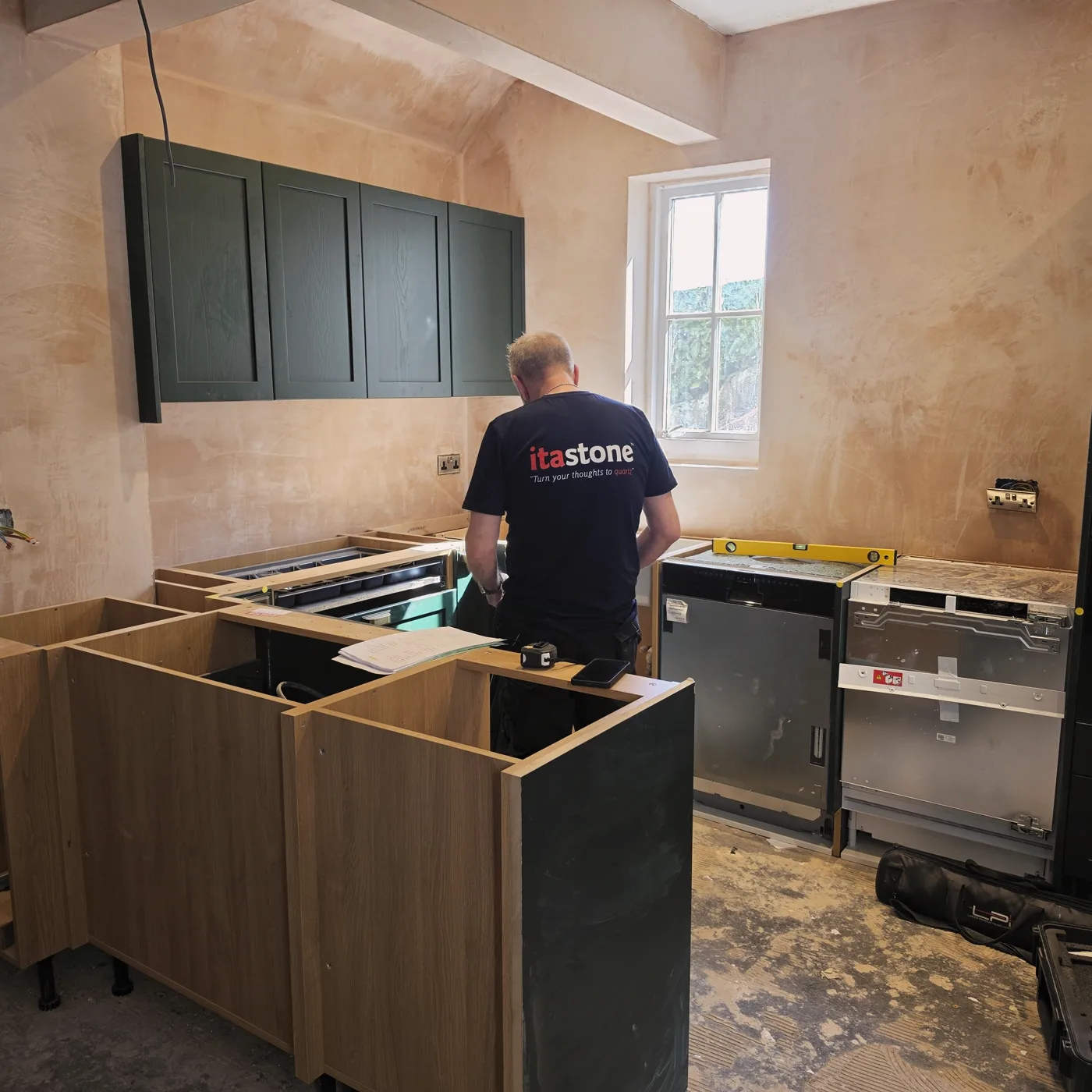 The room stripped back during the build, with a large new opening formed in the wall.