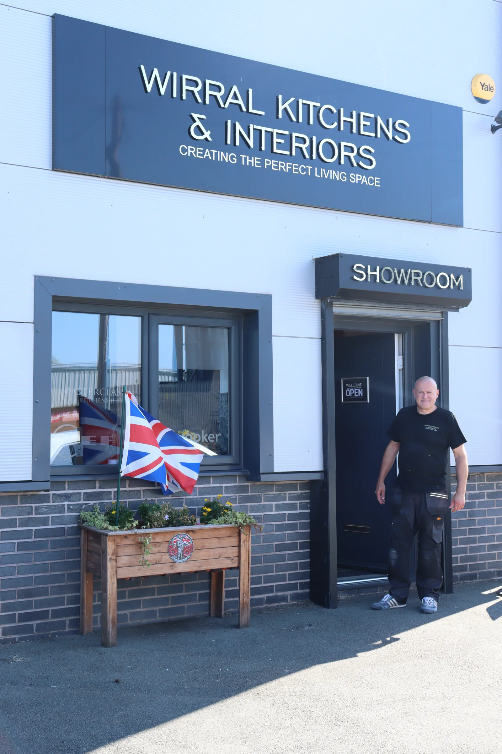 The entrance to the Wirral Kitchens & Interiors showroom at Hilbre Business Park, Hoylake, with the company signage above the door.